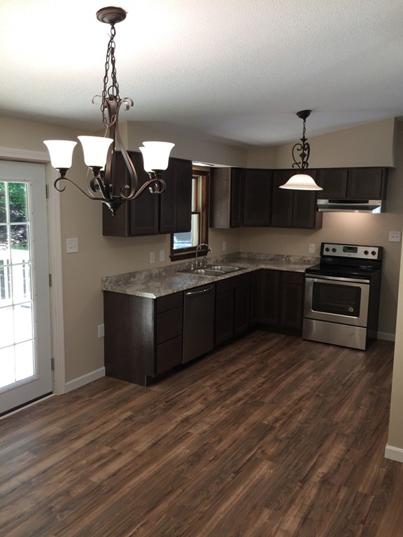 15 Barre Road Templeton, MA 01468 - Photo 3 of 14 a kitchen with stainless steel appliances granite countertop a sink a stove and a wooden floors