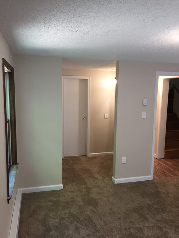 15 Barre Road Templeton, MA 01468 - Photo 8 of 14 an empty room with closet and mirror