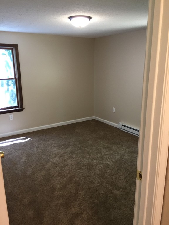 15 Barre Road Templeton, MA 01468 - Photo 9 of 14 an empty room with a window