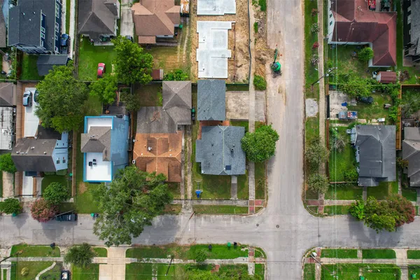 an aerial view of multiple houses with yard