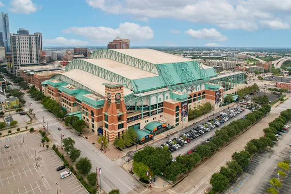 an aerial view of a house with a swimming pool