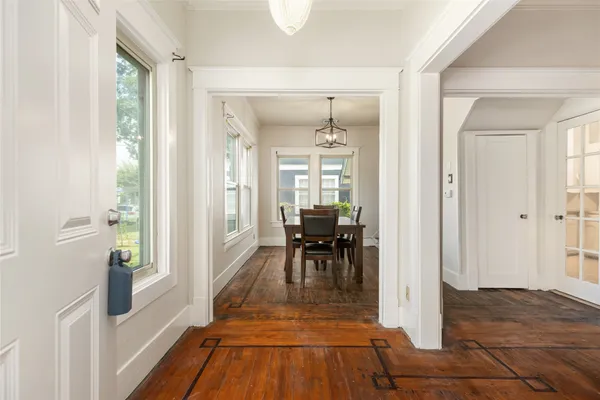 a view of a livingroom with furniture and hardwood floor
