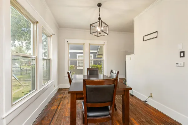a dining room with furniture window wooden floor