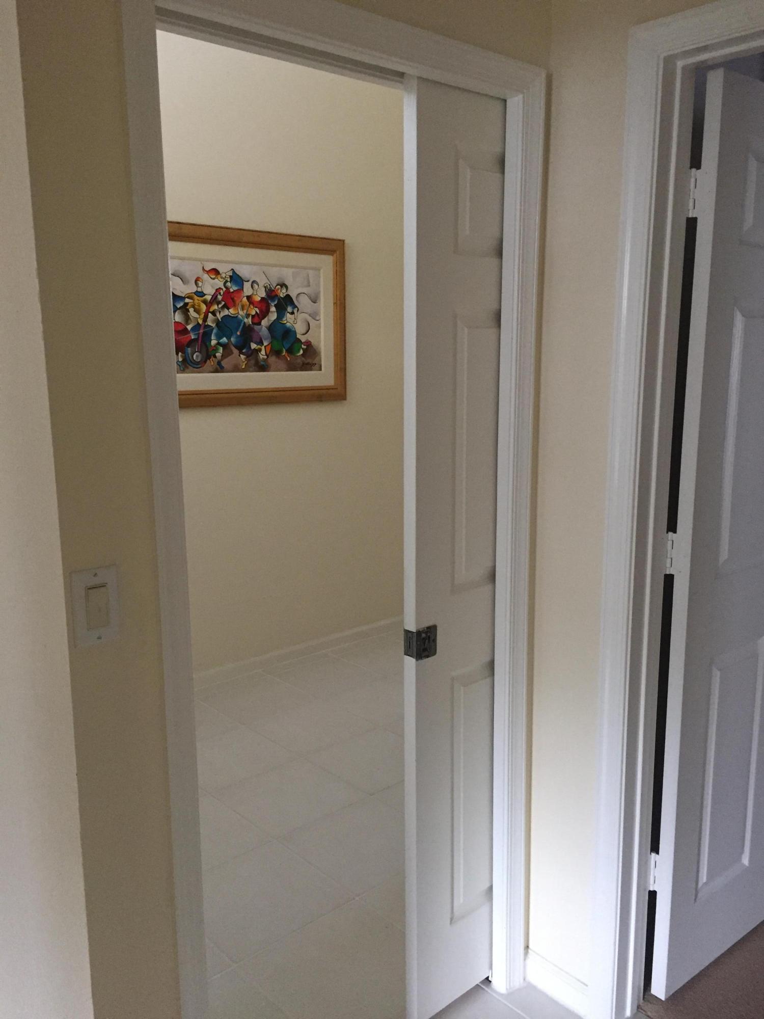 176 Cove Road Greenacres, FL 33413 - Photo 13 of 66 Guest hallway