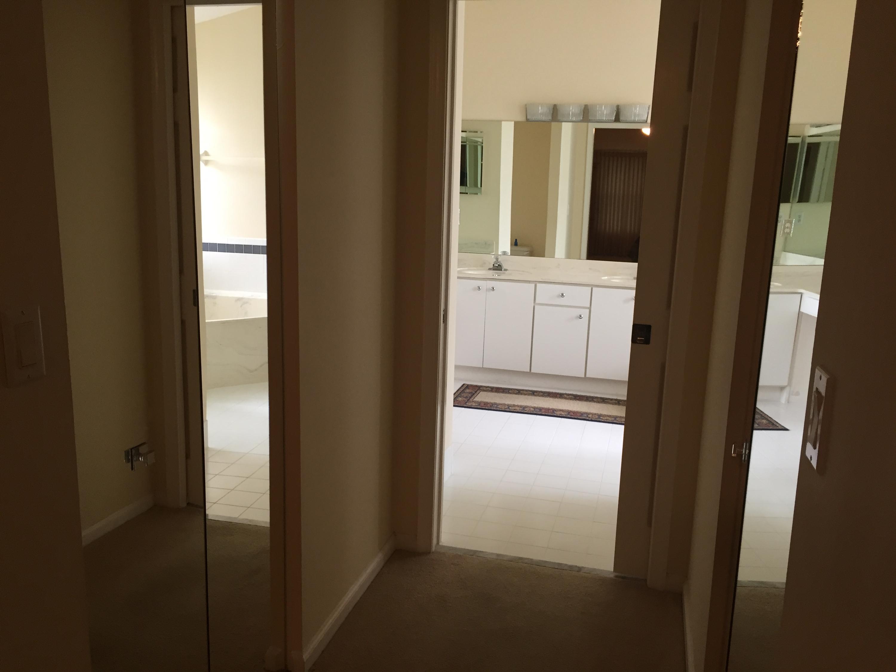 176 Cove Road Greenacres, FL 33413 - Photo 43 of 66 Master bath hallway