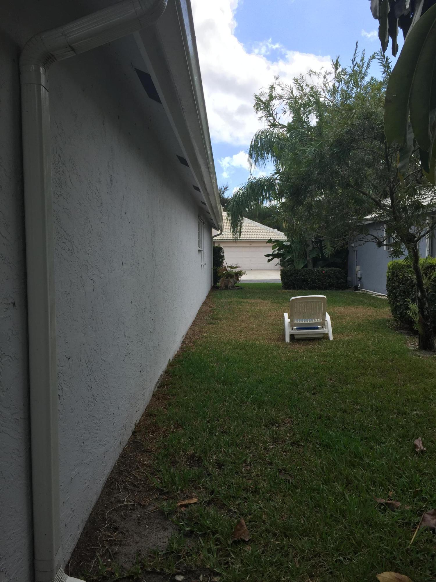 176 Cove Road Greenacres, FL 33413 - Photo 61 of 66 West side of house facing front