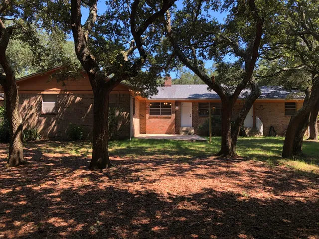 a backyard of a house with lots of green space