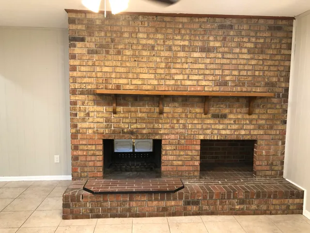 a kitchen with a sink and chandelier