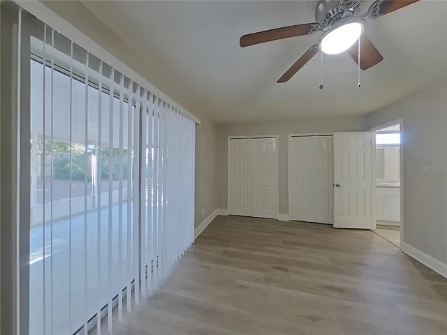 a view of an empty room with a window