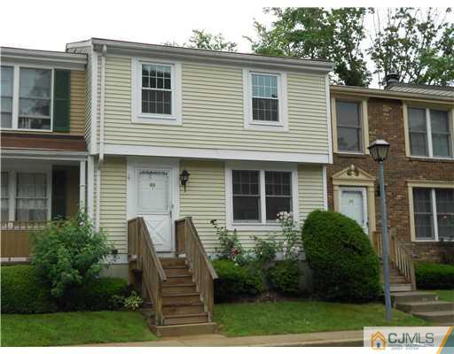 675 Bound Brook Road, Unit 10 Dunellen, NJ 08812 - Photo 1 of 7 a view of a house with a chairs in patio