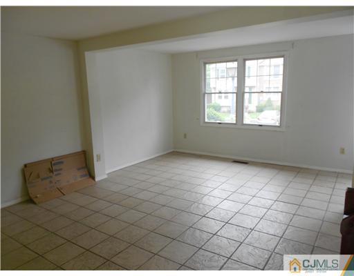 675 Bound Brook Road, Unit 10 Dunellen, NJ 08812 - Photo 2 of 7 an empty room with windows