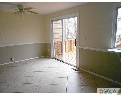 675 Bound Brook Road, Unit 10 Dunellen, NJ 08812 - Photo 5 of 7 a view of an empty room and a window