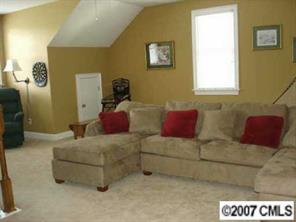 1878 2nd Baxter Crossing Fort Mill, SC 29708 - Photo 3 of 8 a living room with furniture and a window