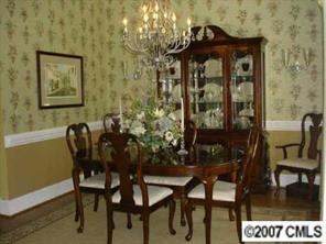 1878 2nd Baxter Crossing Fort Mill, SC 29708 - Photo 4 of 8 a view of a dining room with furniture and chandelier