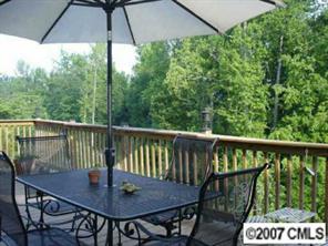 1878 2nd Baxter Crossing Fort Mill, SC 29708 - Photo 5 of 8 a view of a balcony with wooden floor and outdoor seating