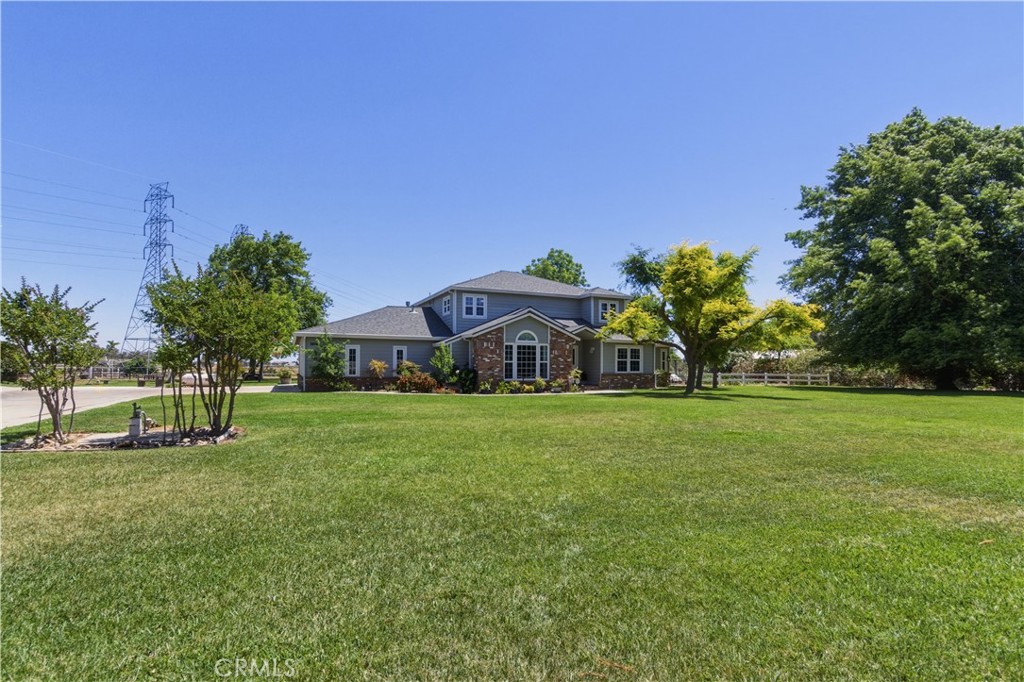 3856 North Gardner Avenue Merced, CA 95340 - Photo 57 of 59 a front view of a house with a yard