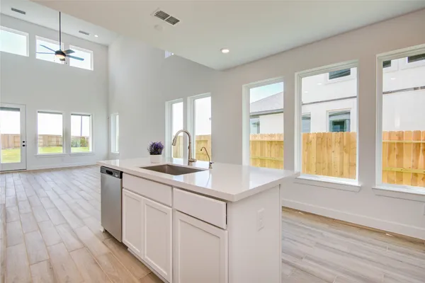 a kitchen with a sink and dish washer