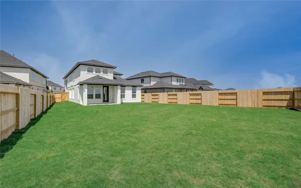 a view of a house with a big yard