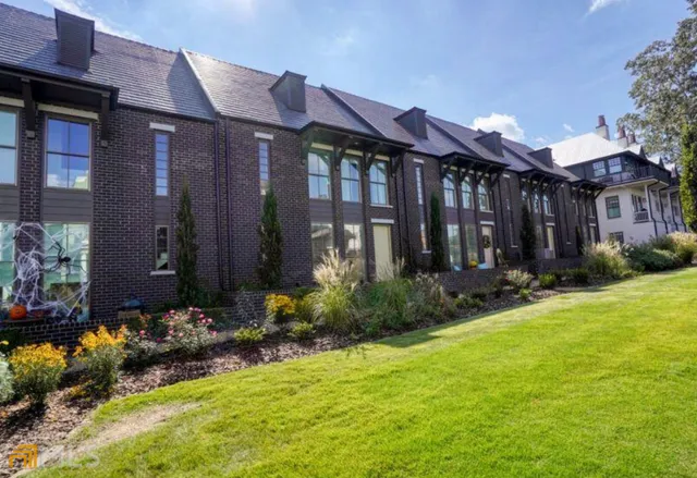 a front view of house with yard and outdoor seating
