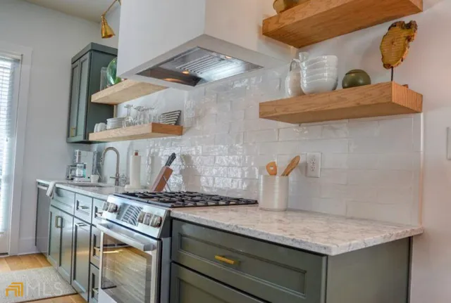 a kitchen with a stove and a sink