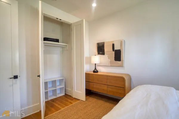 a bedroom with a bed and a cabinets