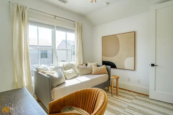 a living room with furniture and a window