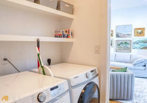 a utility room with dryer and washer