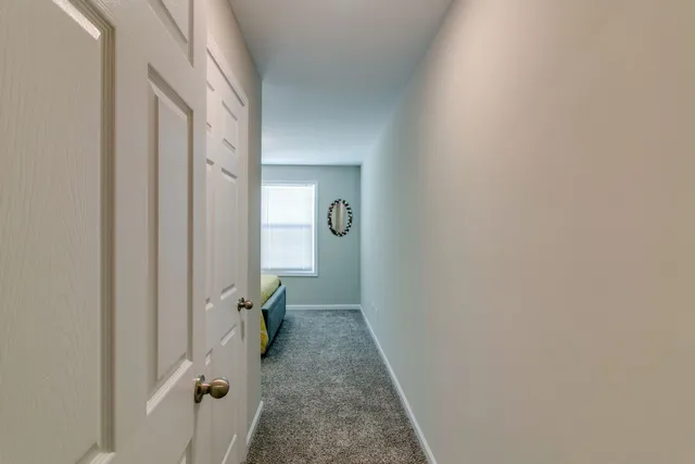 a view of a livingroom from a hallway