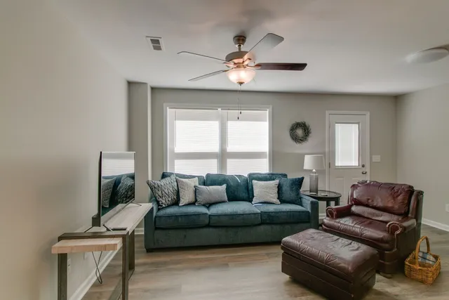 a living room with furniture and a window