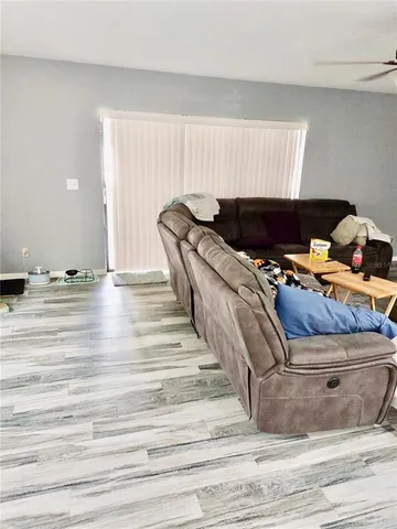 a bed room with a bed and a window