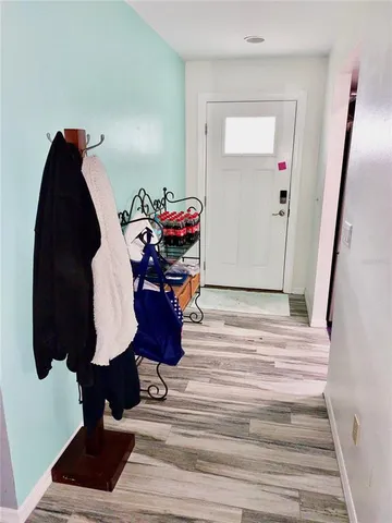 a view of entryway with wooden floor