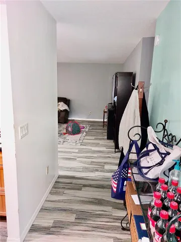 a view of entryway with wooden floor