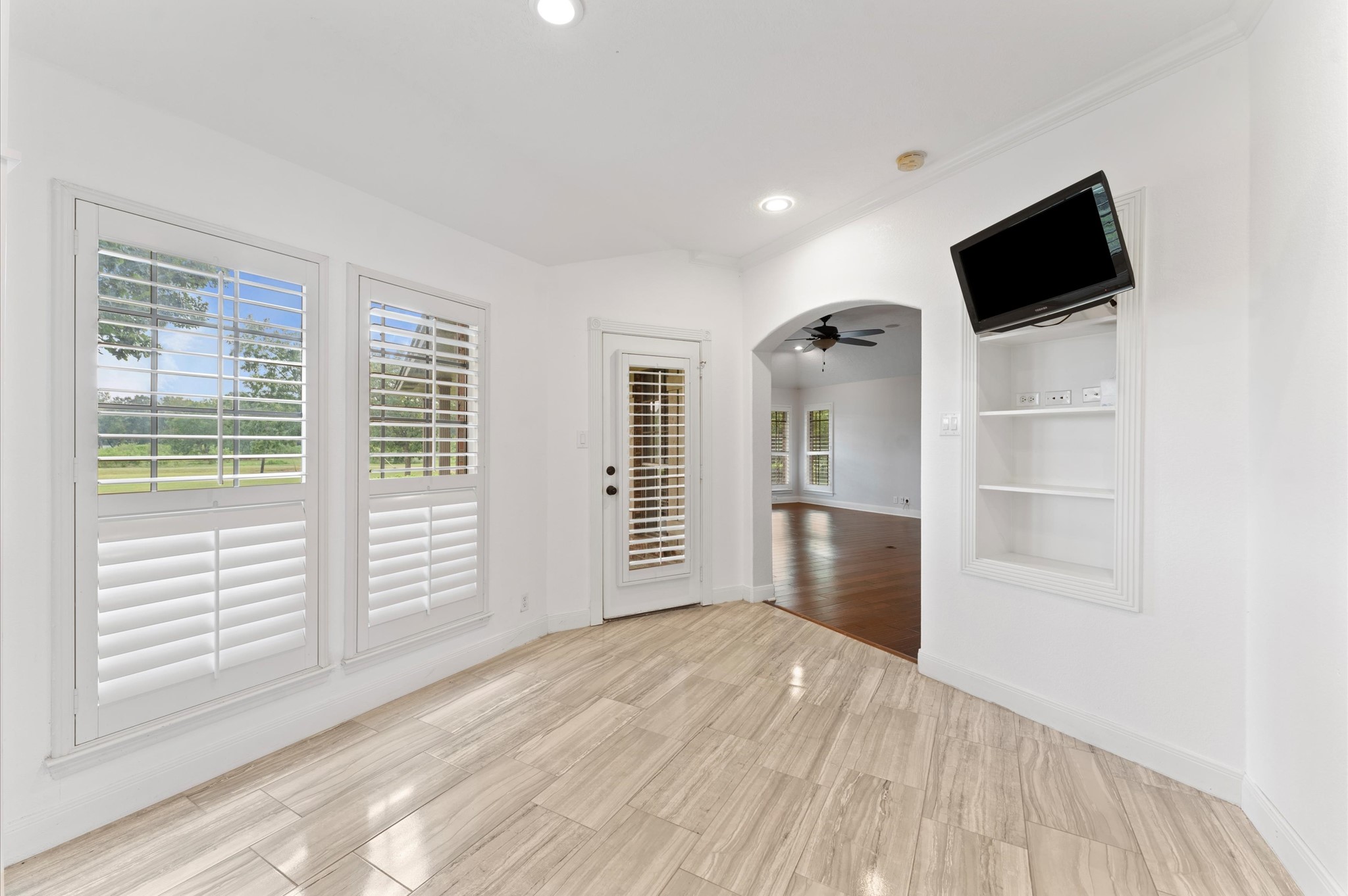 1101 Baker Road Rosenberg, TX 77471 - Photo 18 of 50 a view of empty room with wooden floor and windows
