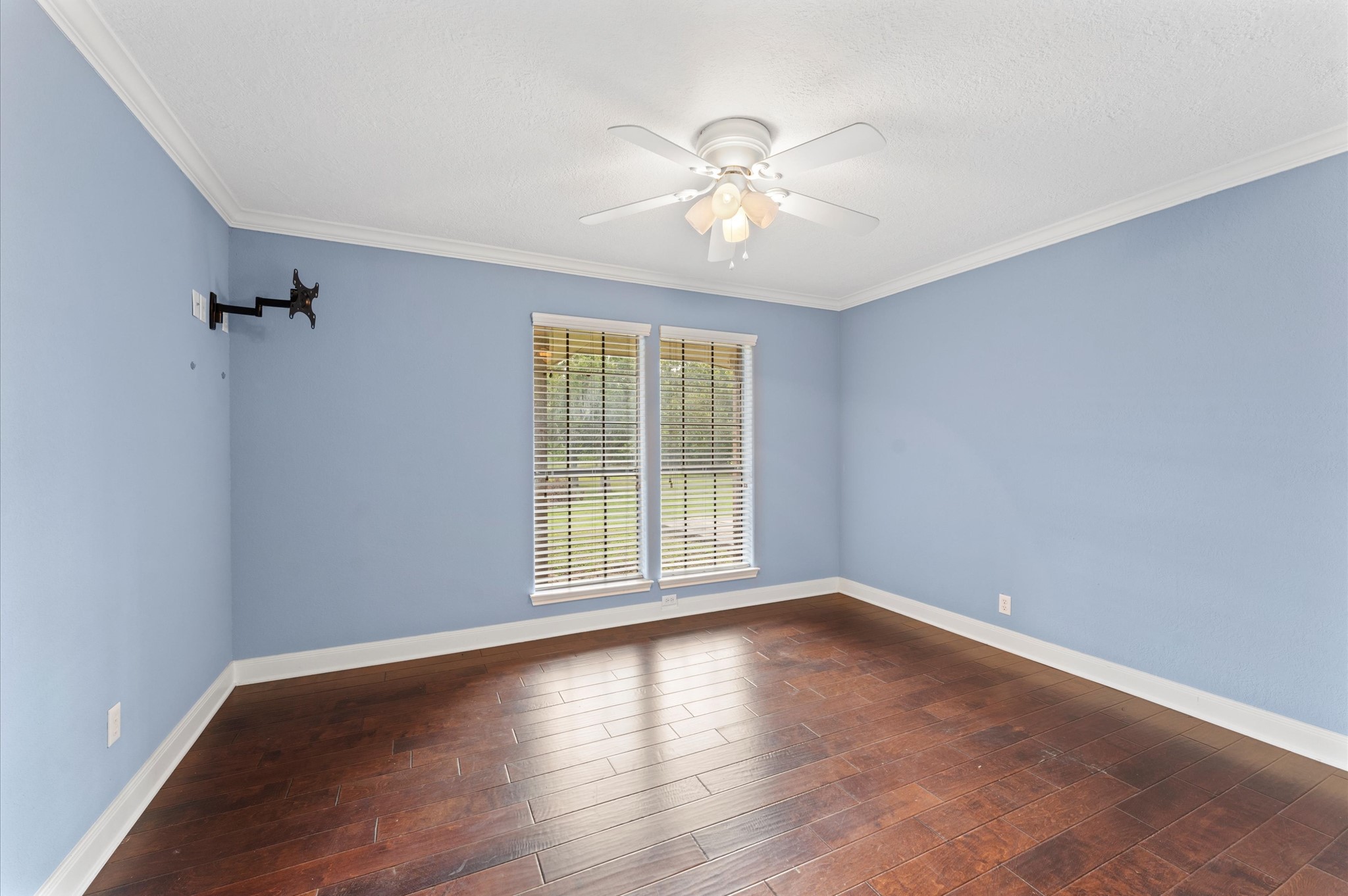 1101 Baker Road Rosenberg, TX 77471 - Photo 19 of 50 a view of an empty room with wooden floor and a window