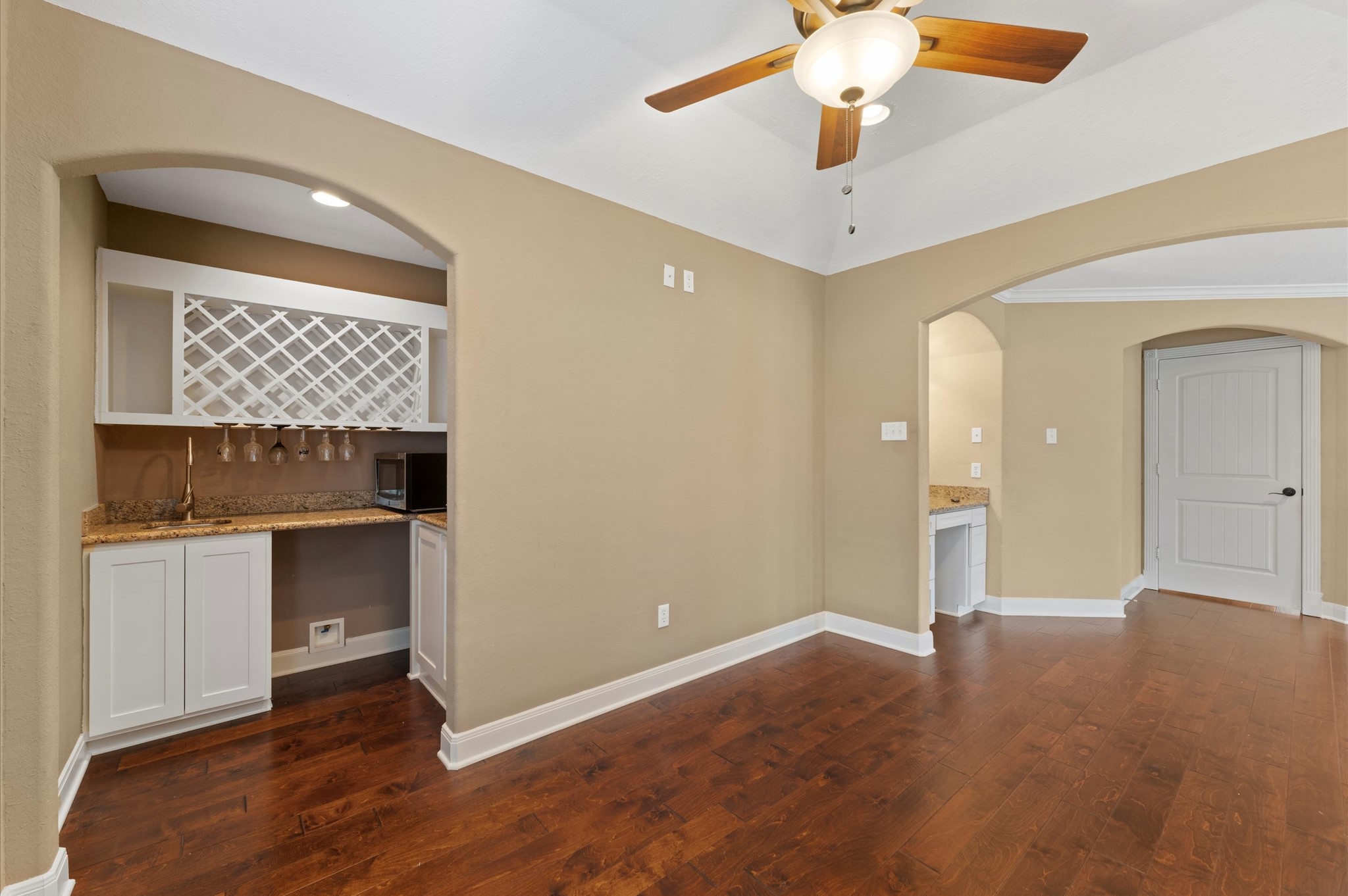 1101 Baker Road Rosenberg, TX 77471 - Photo 24 of 50 a view of an empty room with window and wooden floor