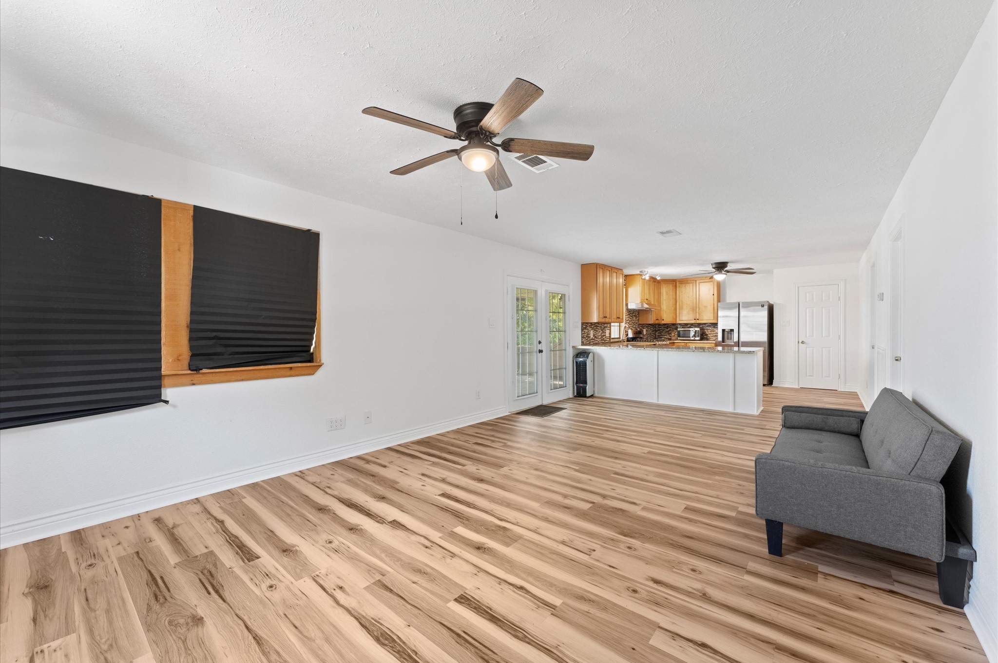 1101 Baker Road Rosenberg, TX 77471 - Photo 39 of 50 a living room with furniture and a wooden floor