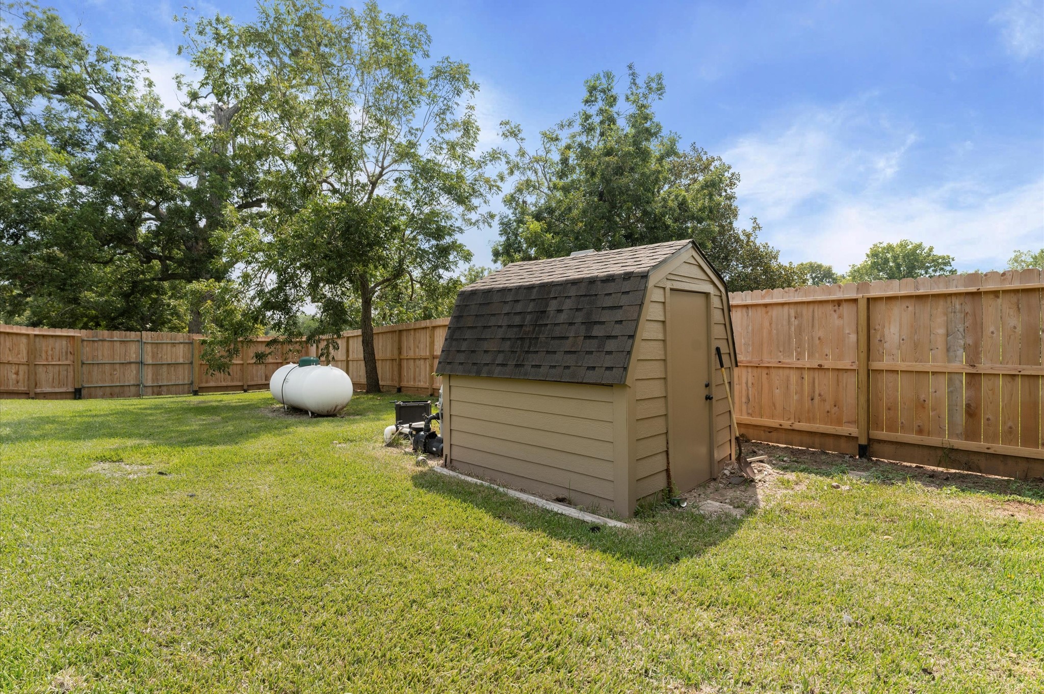 1101 Baker Road Rosenberg, TX 77471 - Photo 45 of 50 a view of a backyard with wooden fence
