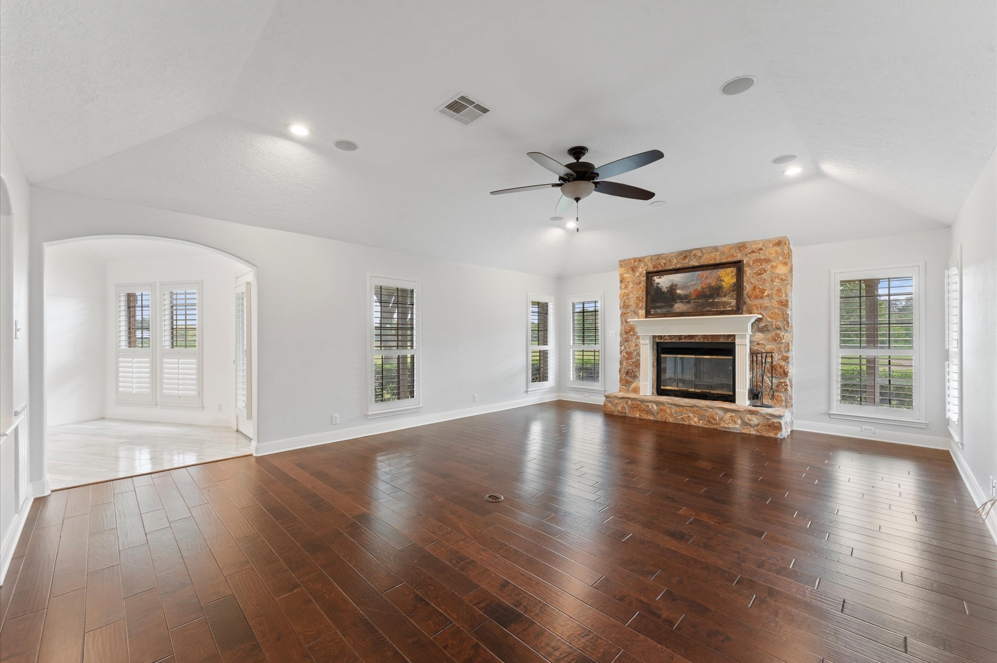 1101 Baker Road Rosenberg, TX 77471 - Photo 5 of 50 a view of an empty room with wooden floor and a window
