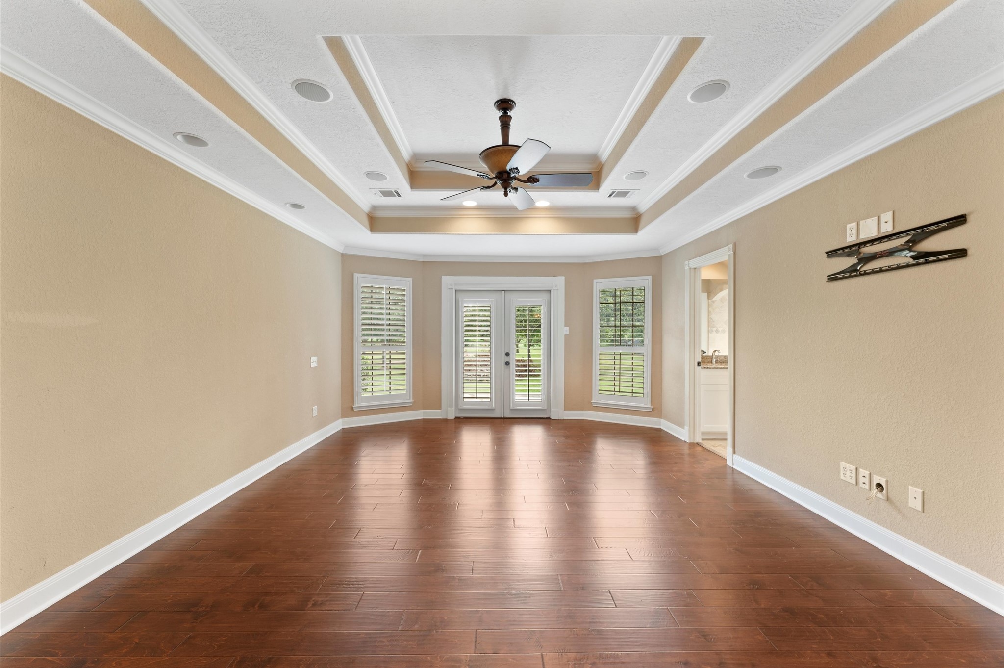1101 Baker Road Rosenberg, TX 77471 - Photo 8 of 50 a view of empty room with wooden floor and fan
