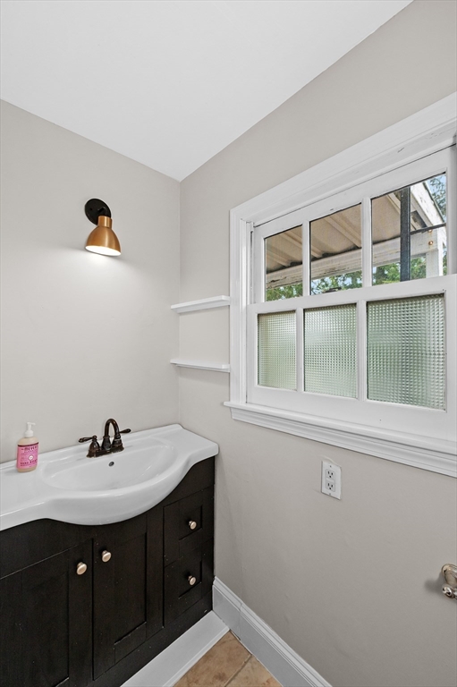 18 Bennett Street, Unit 2 Manchester, MA 01944 - Photo 4 of 21 a sink with a mirror