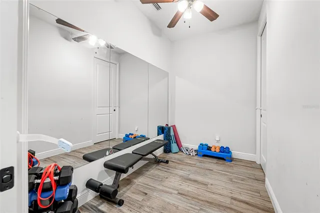 a bedroom with furniture and a large window