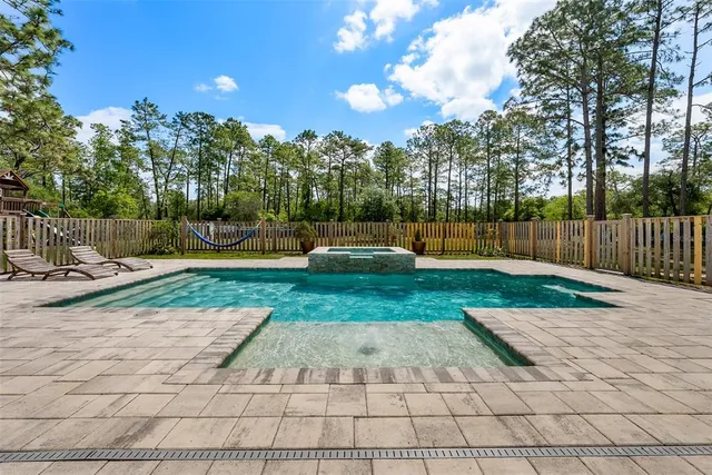 an aerial view of a house with outdoor space