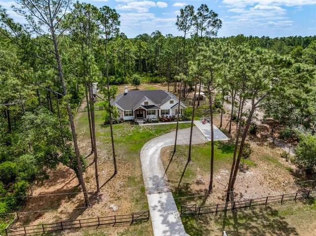 a front view of a house with a yard patio and fire pit