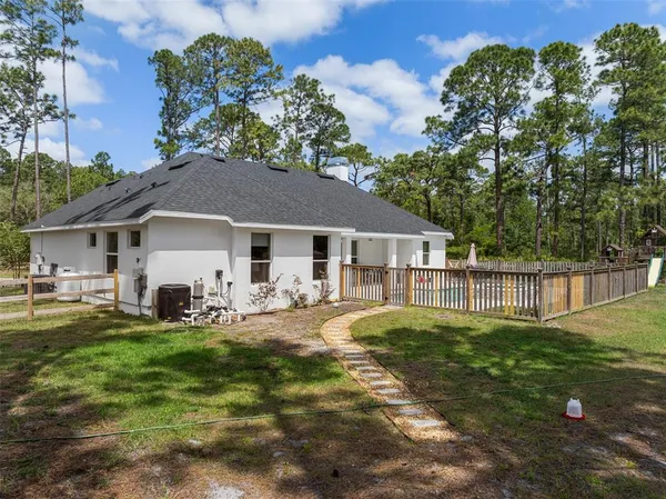 a view of a yard with a tree