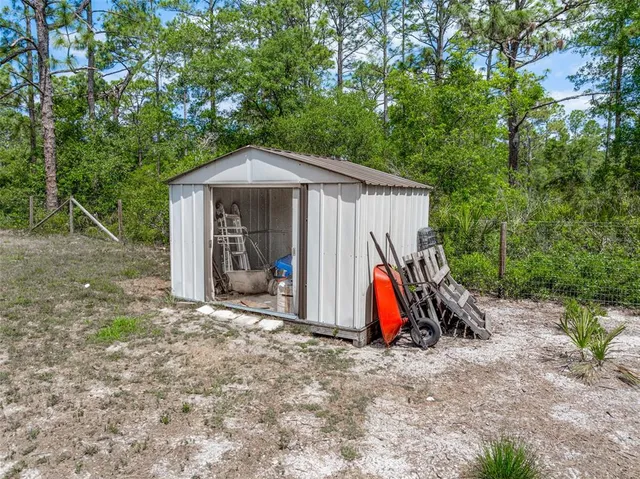 a view of a backyard patio and entertaining space