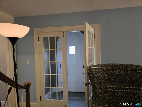 a view of bedroom with furniture and wooden floor