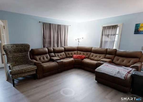 a living room with furniture and a window