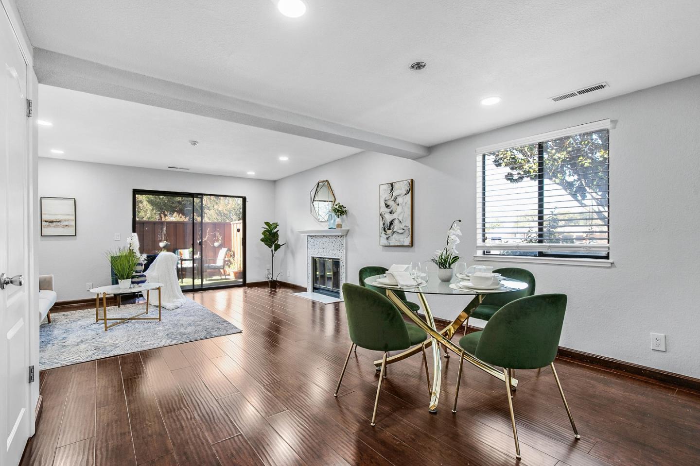 a view of a dining room with furniture window and wooden floor