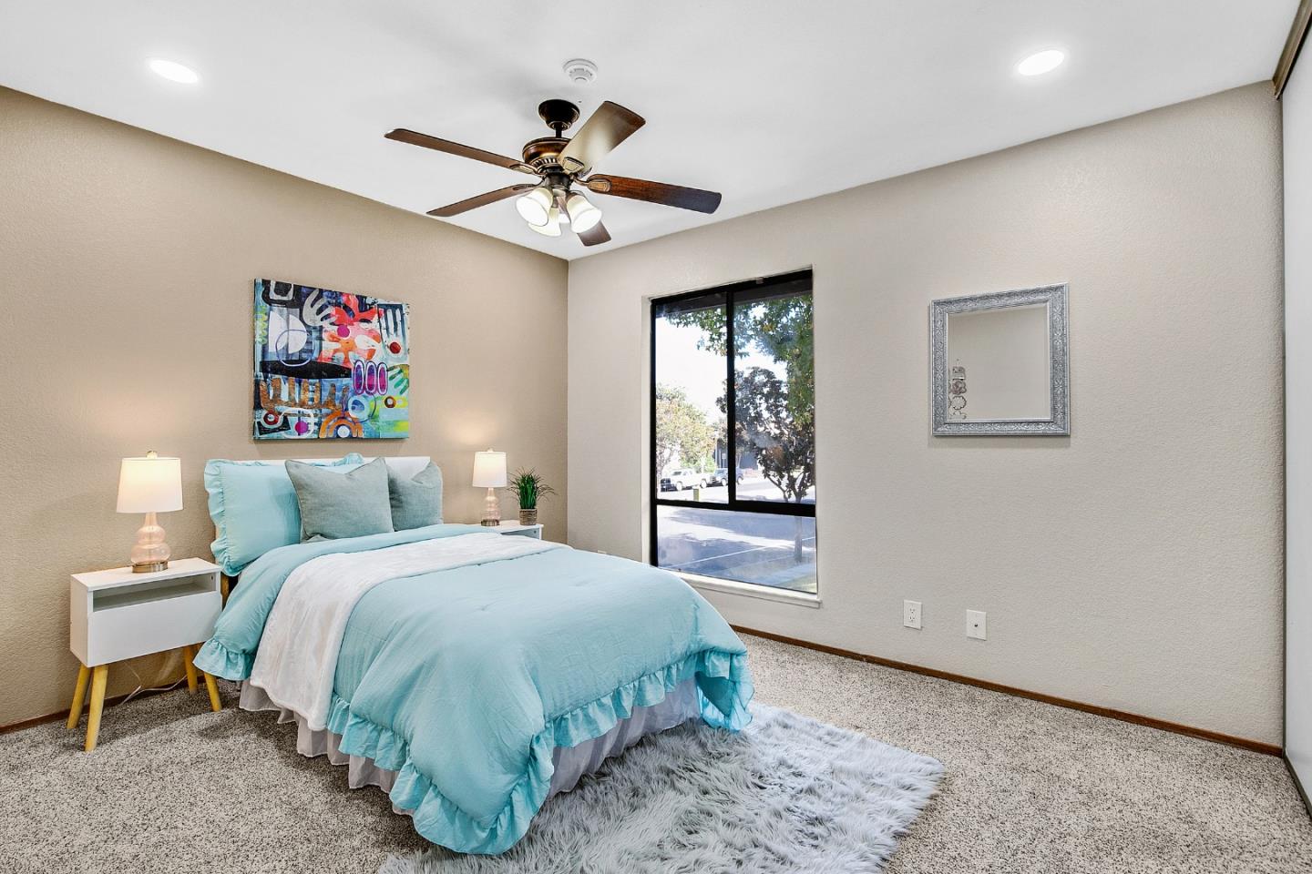 36913 Newark Boulevard, Unit A Newark, CA 94560 - Photo 11 of 20 a spacious bedroom with a bed and a chandelier