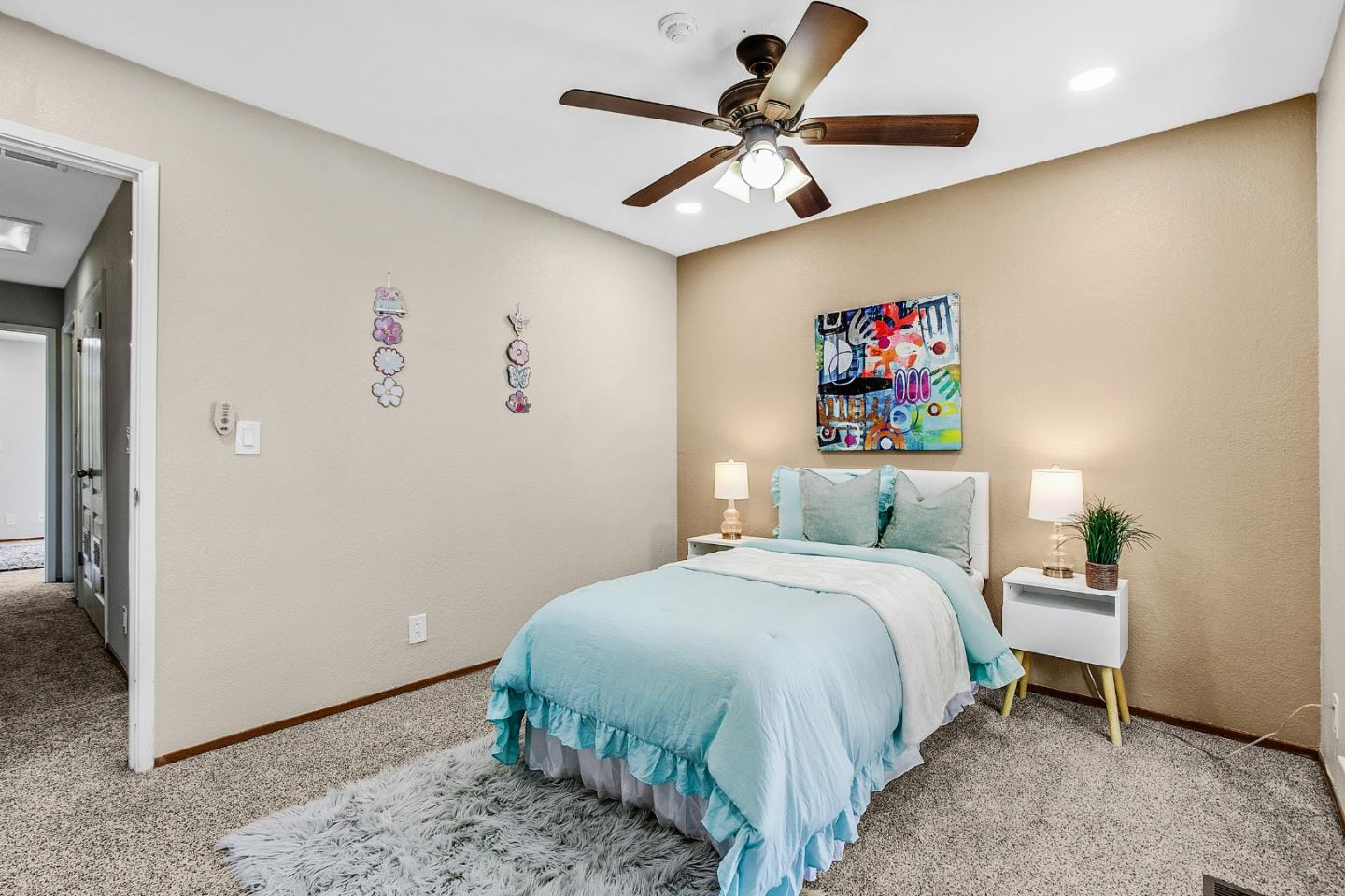 36913 Newark Boulevard, Unit A Newark, CA 94560 - Photo 12 of 20 a bedroom with a bed and a chandelier